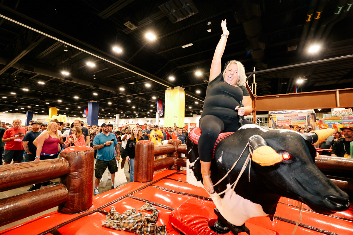 Mechanical bull riding at GABF. Great American Beer Festival. Photo © Brewers Association